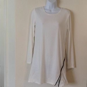Long sleeved cream colored top with black zipper